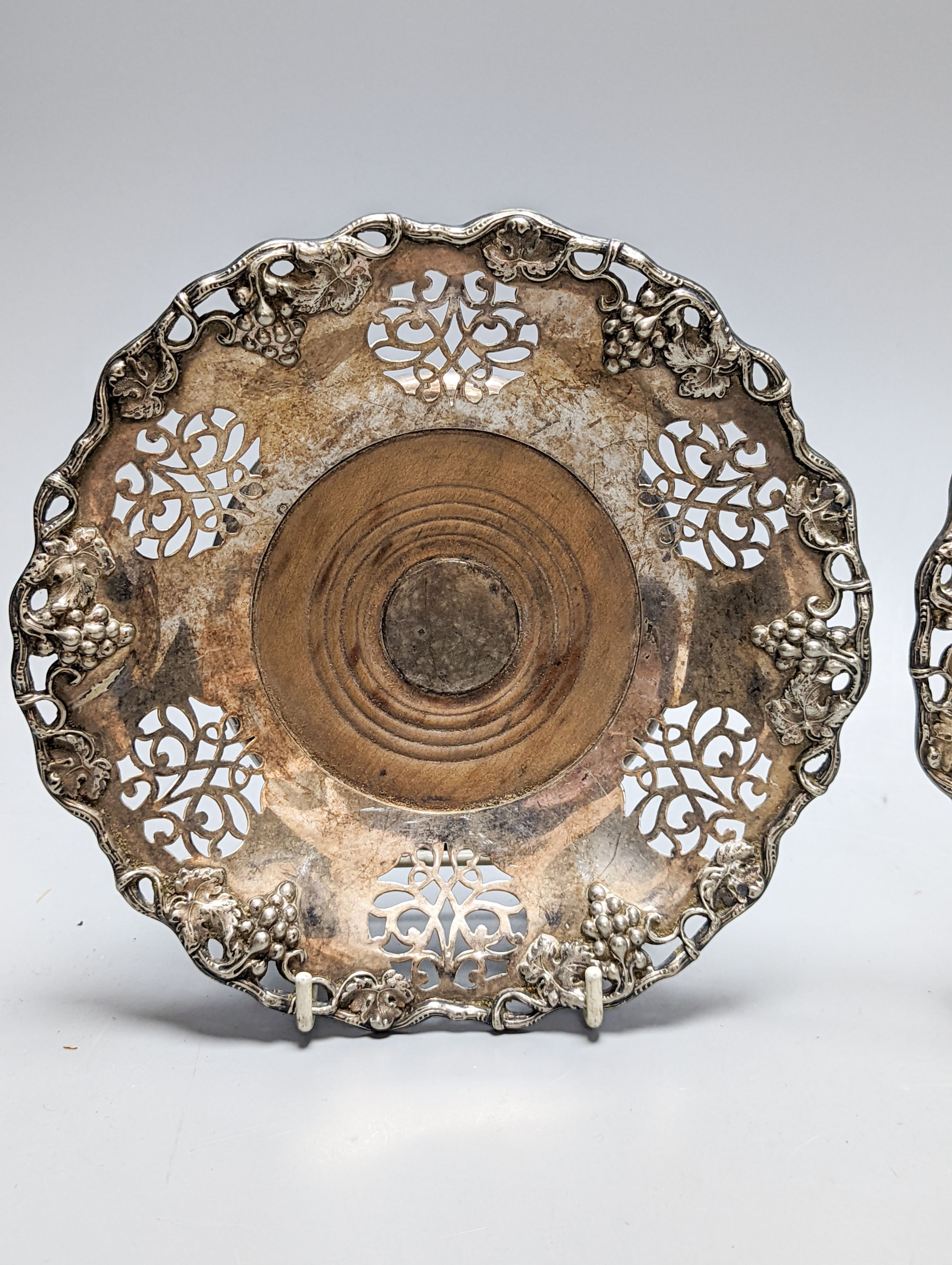 A pair of silver plated wine coasters 20cm